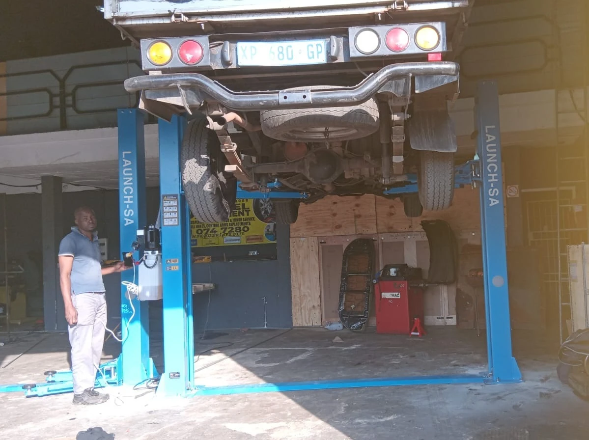 MEGA ZONE TYRES 27 Shamrock Road PrimroseGermiston 2 post vehicle lift installation 2 - Launch SA - Launch SA MEGA ZONE TYRES 27 Shamrock Road PrimroseGermiston 2 post vehicle lift installation 2